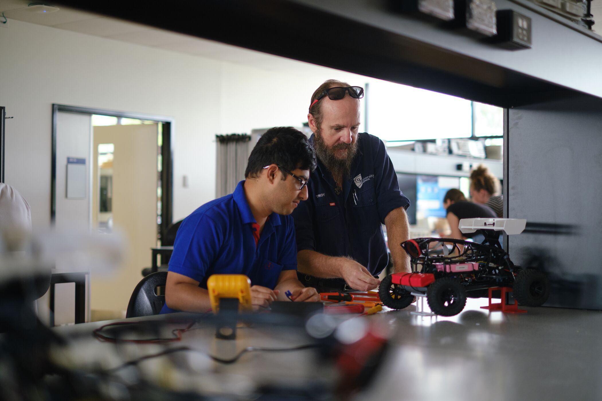 Engineering student working with teacher at CQU Rockhampton. 