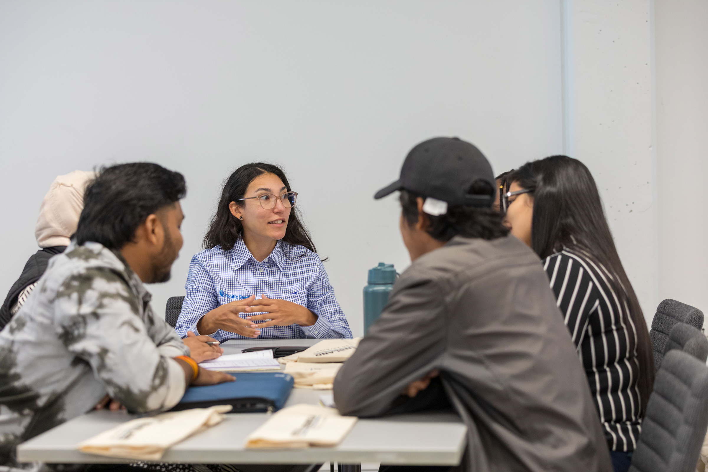 An employer mentoring a group of students at a Study Queensland Innovation Challenge in Toowoomba, Queensland, Australia. 